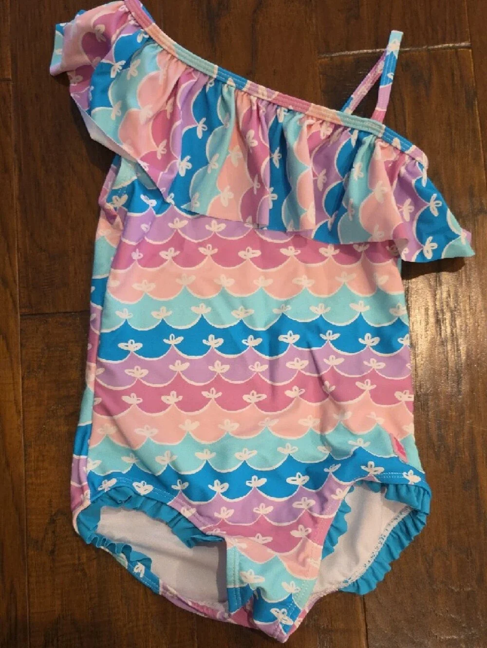 NWOT Ruffle Butts Pastel Pink Purple Aqua One-Shoulder Ruffle Swimsuit Size 7